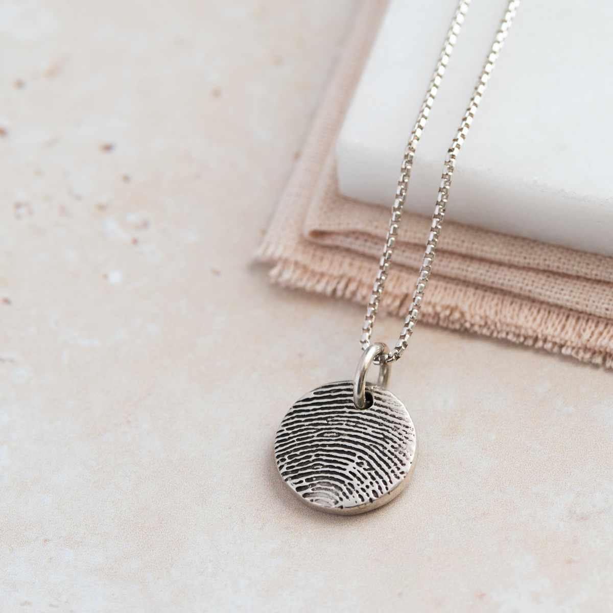 Silver 2025 thumbprint necklace